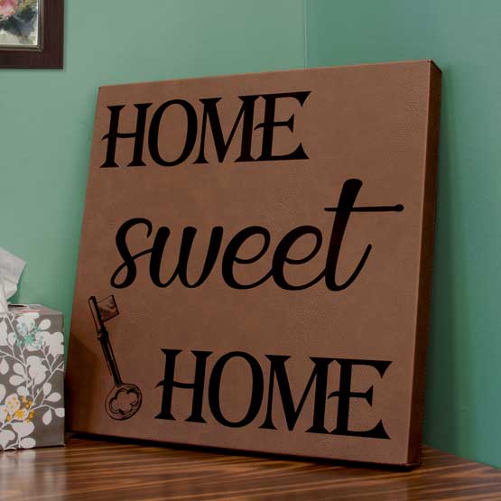 Custom Dark Brown Faux Leather Wrapped Square Canvas Laser Engraved With Home Sweet Home And Key Art On Shelf With Tissue