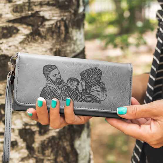 Woman Hands Outdoors Holding Gray Faux Leather Trifold Wallet With Wrist Strap And Engraved With Couple With Dog Art