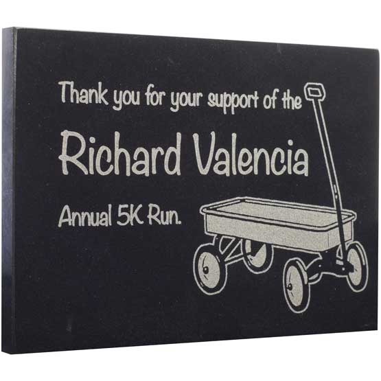 Custom Black Marble Paperweight Laser Engraved With Pull Wagon Art And Name And Thank You Message Against White Background