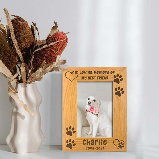 Red Alder Picture Frame With Dog Photo And Engraved With Hearts And Paw Prints And Dog Memorial Details On Shelf With Vase