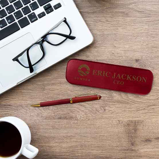 Custom Rosewood Pen Case Engraved With Logo And CEO Name Beside Matching Pen On Wood Office Desk With Laptop And Coffee