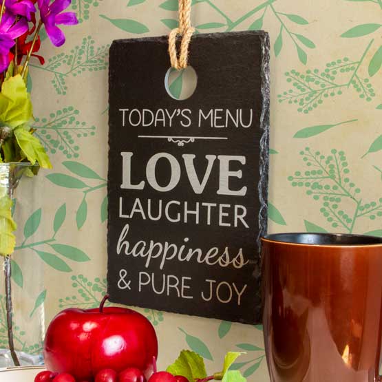 Custom Cutting Board Style Slate Sign Printed With Today’s Menu Message Hanging Via Rope On Wall With Flower Art