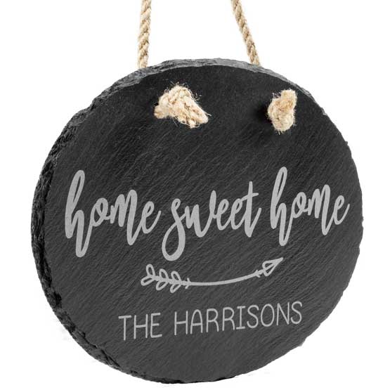 Custom Slate Oval Sign Printed With Home Sweet Home And Family Name Hanging Via Rope Against White Background