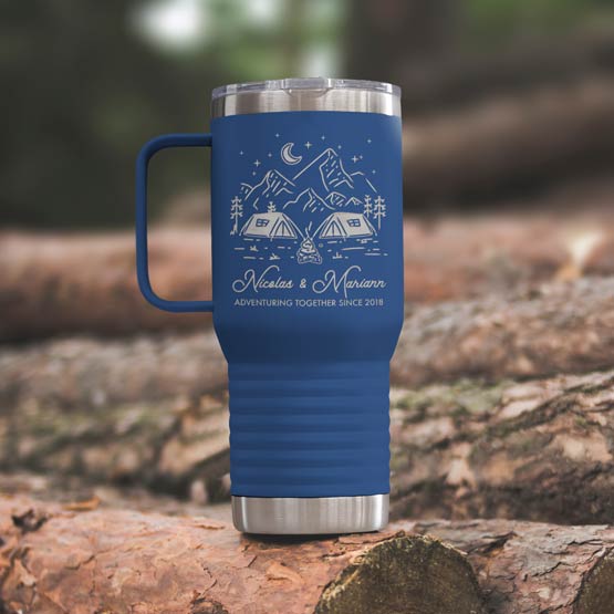 Blue Stainless Steel Coffee Tumbler With Handle And Engraving Of Camping Clipart And Names And Date On Wood Log Outdoors