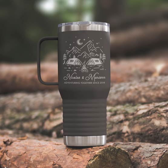 Gray Stainless Steel Coffee Tumbler With Handle And Engraving Of Camping Clipart And Names And Date On Wood Log Outdoors
