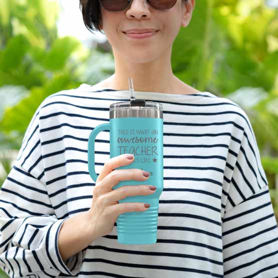 Happy Woman Outdoors Holding Custom Teal Stainless Steel Coffee Tumbler With Handle And Straw And Teacher Message