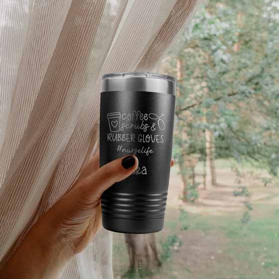 Woman Hand Outdoors Holding Black Stainless Steel Coffee Tumbler Engraved With Nurse Life Message And Name And Coffee Cup Art