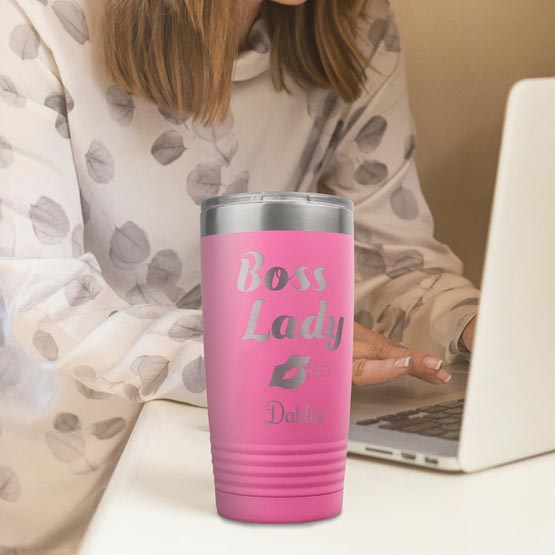 Woman Working At Desk With Laptop And Pink 20 Ounce Tumbler Laser Engraved With Girl Boss Text And Name And Lips Artwork