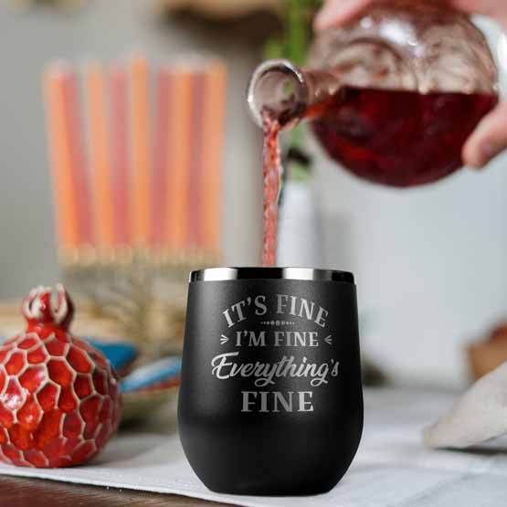 Bottle Pouring Wine Into Black 12 Ounce Stemless Wine Tumbler Engraved With It’s Fine I’m Fine Everything’s Fine Message