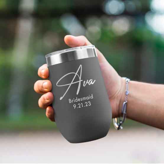Woman Hand Outdoors Holding Custom Gray Stemless Wine Tumbler Engraved With Name And Date And Bridesmaid Text