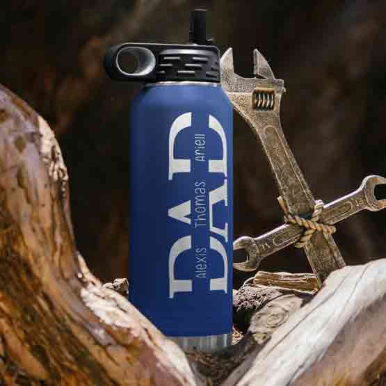 Custom Blue 32 Ounce Water Bottle Engraved With Children Names Inside Dad Text Sitting On Log Outdoors Beside Wrenches