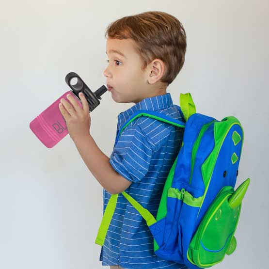 Little Boy With Backpack And Drinking From Pink Stainless Steel Child Water Bottle With Straw And Engraved Name