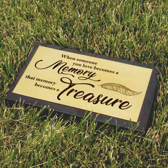 Custom Engraved Brass Headstone In Green Grass.