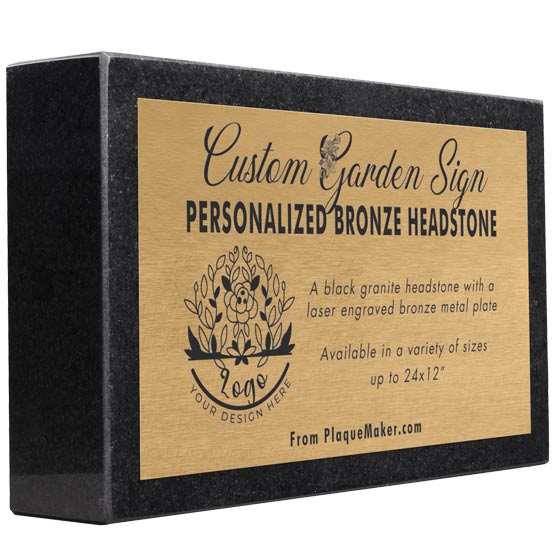 A rectangular black granite headstone with a bronze metal plate mounted to the front, featuring sample engraved text, placeholder artwork, and set at an angle, displayed on a plain white background.