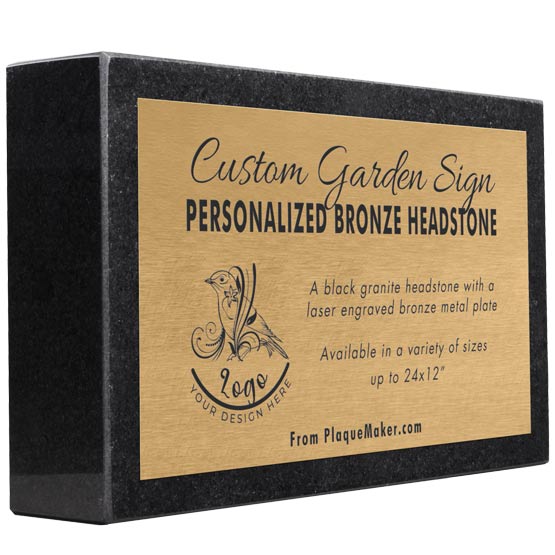 A rectangular black granite headstone with a bronze metal plate mounted to the front, featuring sample engraved text, placeholder artwork, and set at an angle, displayed on a plain white background.