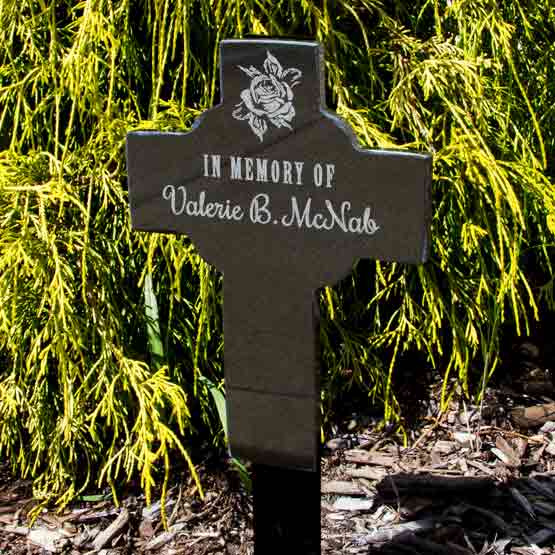 Celtic Cross Shaped Granite Headstone Engraved With Flower Art And Memorial For Valerie McNab Standing In Garden Via Spike