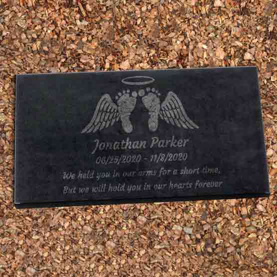 Custom Engraved Headstone For Baby Laying In Mulch.