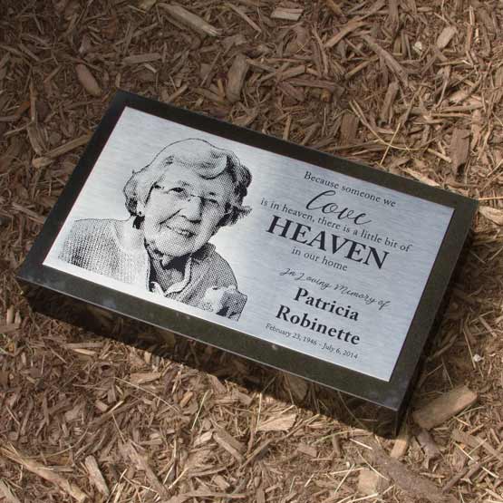 Engraved Stainless Steel Headstone With Text And Picture In Mulch.
