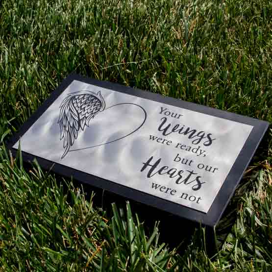 Custom Titanium Headstone On Granite Laying In Grass.