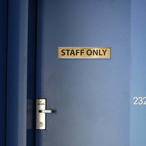 Brass Office Plate Laser Fused With Staff Only Text Mounted Onto Blue Office Door Via Silver Bracket Near Handle