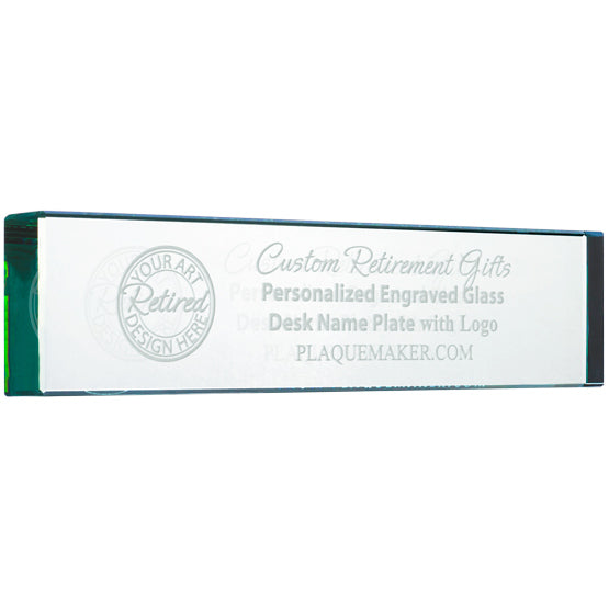 A clear glass name plate with custom engraved text and placeholder artwork, displayed at a slight angle on a white background.