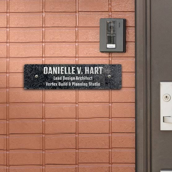 Granite Office Name Plate Engraved With Name And Architect Details Mounted On Brick Wall Via Standoffs Beside Office Door