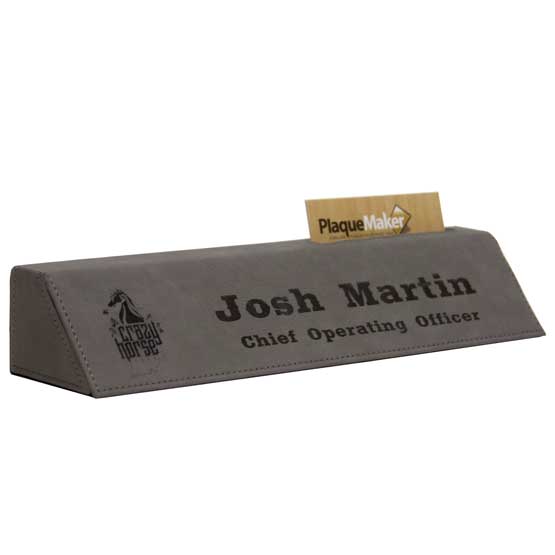 Gray Faux Leather Desk Wedge With Card Slot And Laser Engraved With Logo And Name And Chief Operating Officer Text