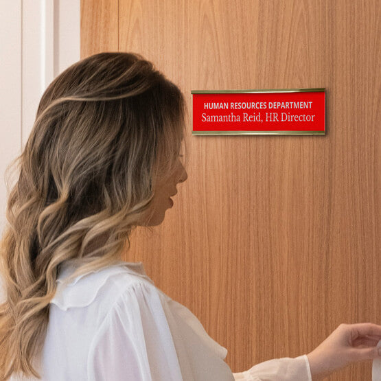 Woman Opening Door With A Red Plastic Office Name Plate Engraved With Human Resources Details And Mounted Via Gold Bracket