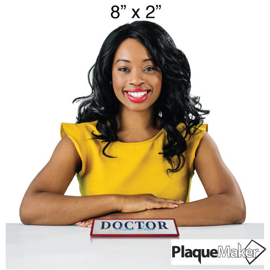 Woman with a custom 'Doctor' name plate with PlaqueMaker branding