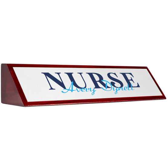 Rosewood Desk Wedge With White Aluminum Plate Printed With Nurse Avery Dynell In Blue Against A White Background