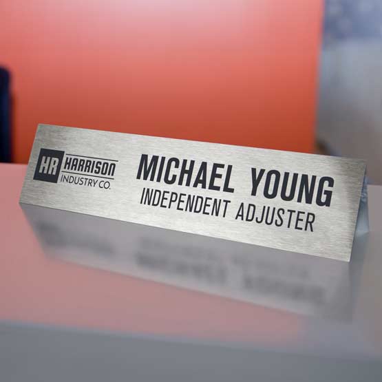 Custom Engraved Stainless Steel Table Tent with Logo and Name on Metal Desk