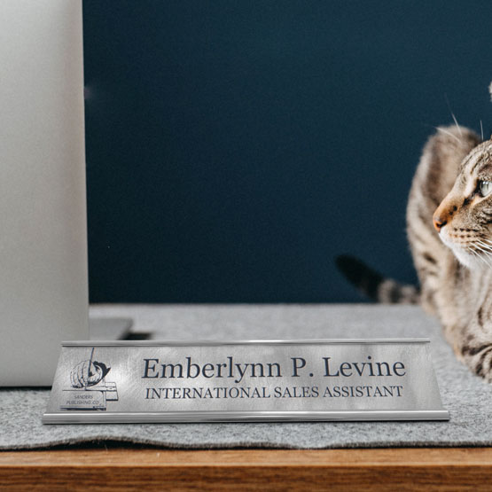 Custom Engraved Titanium Desk Name Plate On Mat Near Cat And Laptop.