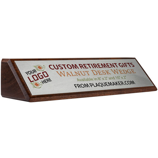 A walnut wood desk wedge with custom silver metal plate with printed text and placeholder artwork, displayed at a slight angle on a white background.