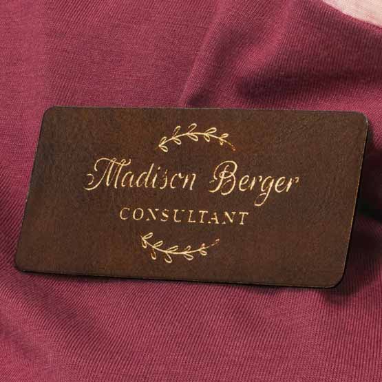 Laser Engraved Rustic With Gold Engraving Faux Leather Name Tag On Pink Shirt.