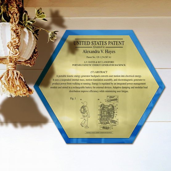 Honeycomb Patent Plaque With Blue Acrylic Board And Gold Plate Printed With Sample Details Mounted Onto Wall Near Plant