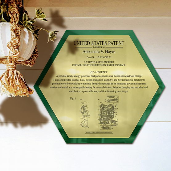 Honeycomb Patent Plaque With Green Acrylic Board And Gold Plate Printed With Sample Details Mounted Onto Wall Near Plant