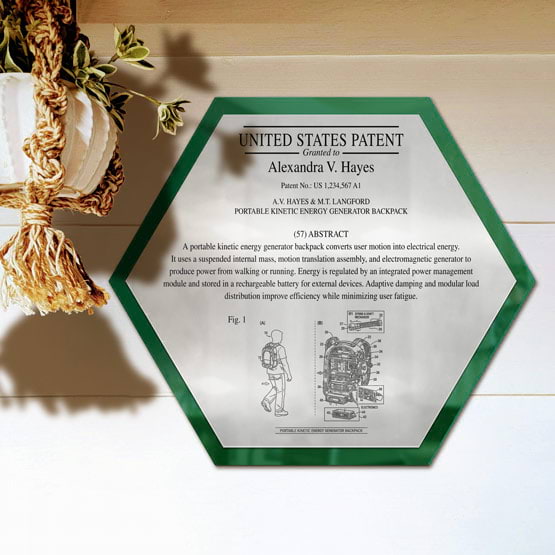 Honeycomb Patent Plaque With Green Acrylic Board And Silver Plate Printed With Sample Details Mounted Onto Wall Near Plant