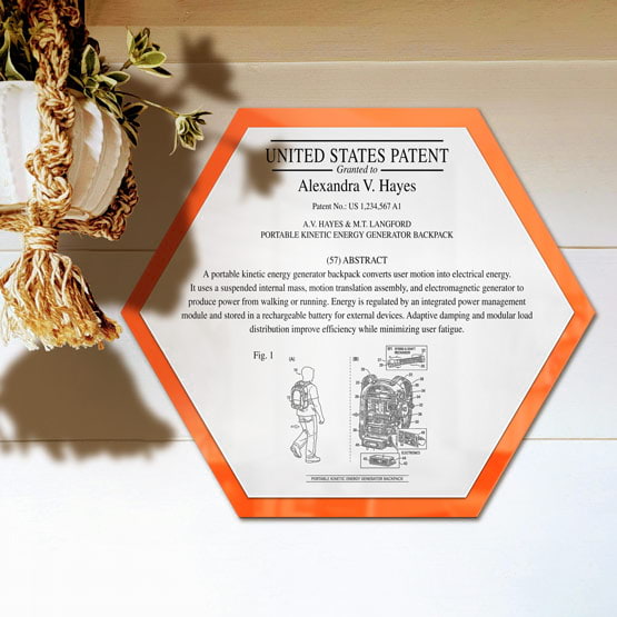 Honeycomb Patent Plaque With Orange Acrylic Board And White Plate Printed With Sample Details Mounted Onto Wall Near Plant