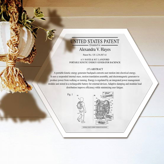 Honeycomb Patent Plaque With White Acrylic Board And White Plate Printed With Sample Details Mounted Onto Wall Near Plant