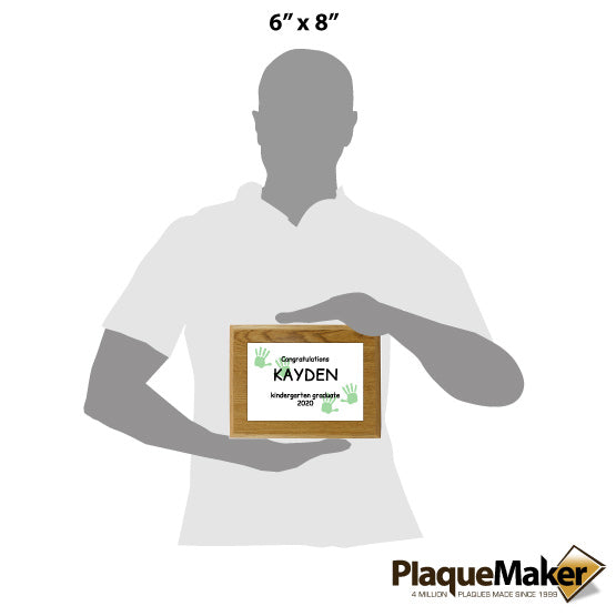 Size Guide Featuring Gray Man Holding 6x8 Inch Kindergarten Graduation Plaque.