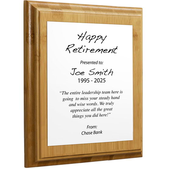 Custom White Aluminum Plaque With Bamboo Board And Printed With Happy Retirement Message Against A White Background