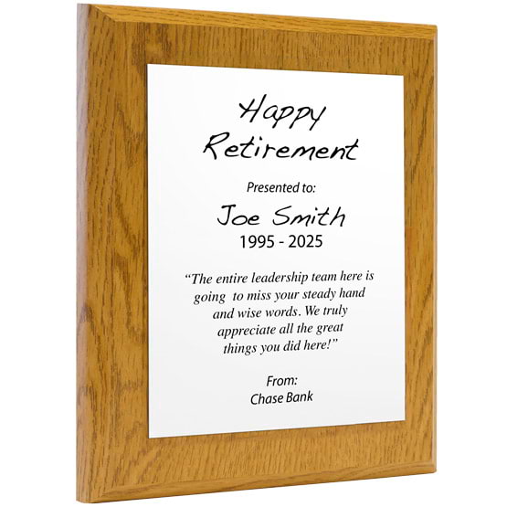 Custom White Aluminum Plaque With Oak Board And Printed With Happy Retirement Message Against A White Background
