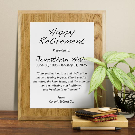 White Aluminum Plaque With Oak Board And Printed With Happy Retirement Message On Shelf With Plant And Notebooks