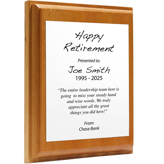 Custom White Aluminum Plaque With Solid Cherry Board And Printed With Happy Retirement Message Against A White Background