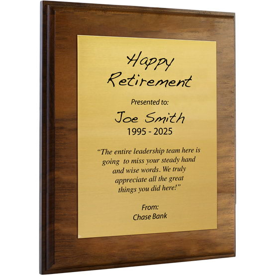 Custom Gold Aluminum Plaque With Solid Walnut Board And Printed With Happy Retirement Message Against A White Background