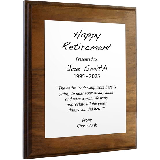Custom White Aluminum Plaque With Solid Walnut Board And Printed With Happy Retirement Message Against A White Background