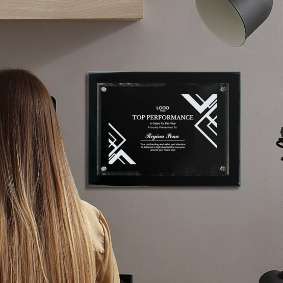 Custom Floating Glass Plaque On Black Board With Logo For Regina Pena On Wall.