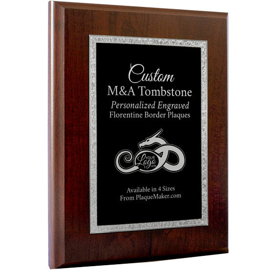 A custom M&A Tombstone plaque with a wooden board and a black metal plate with decorative silver boarder that features custom engraved text and placeholder art.