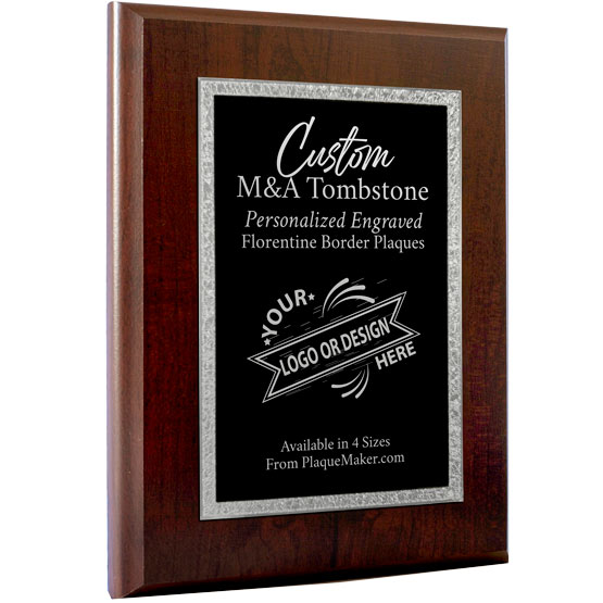 A custom M&A Tombstone plaque with a wooden board and a black metal plate with decorative silver boarder that features custom engraved text and placeholder art. 