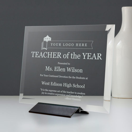 Custom Engraved Glass Plaque Award For Teacher Of The Year With Message And Black Base On White Shelf Beside Vase